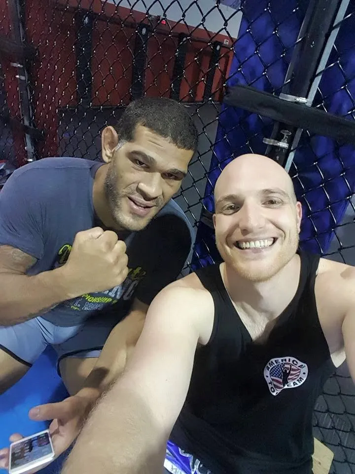 Eitan with Antônio "Bigfoot" Silva at the cage