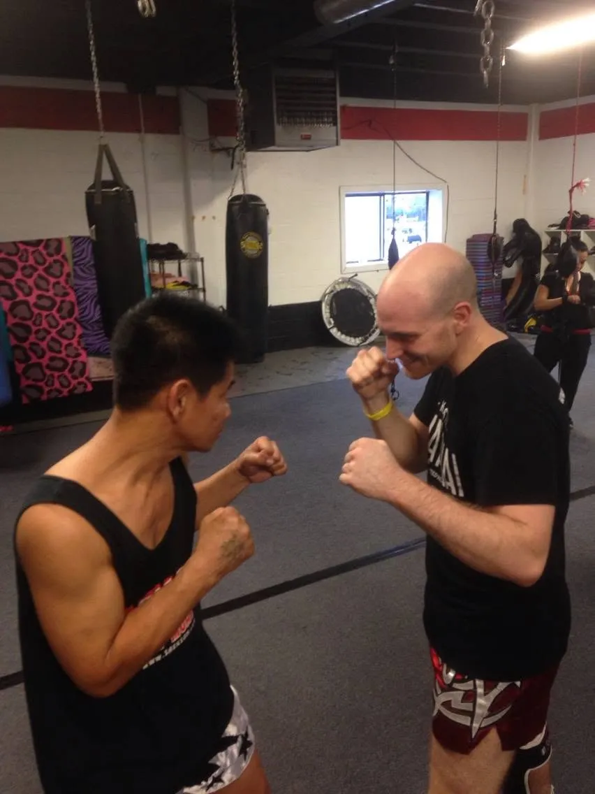 Eitan squaring off with Saekson Janjira at the gym