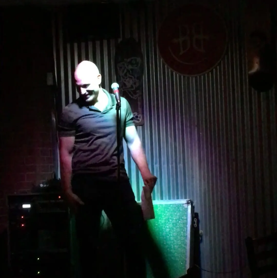 Eitan mid-set at an open mic in Colorado